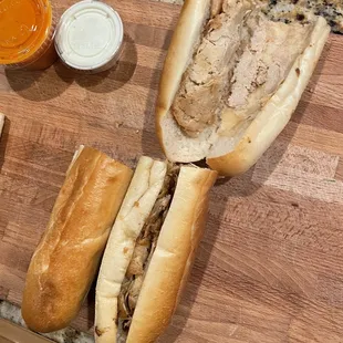 two sandwiches on a cutting board