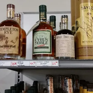 a shelf of liquor bottles