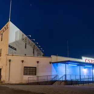 Located in the OB Mac building. Follow the blue lights to the mural door.