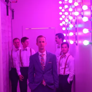 Grooms + his men in the hallway.