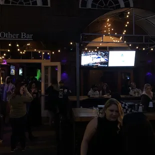 a woman sitting at a bar