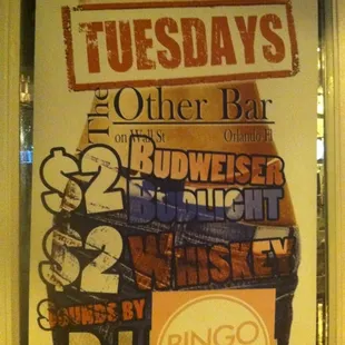 a poster of a man holding a beer