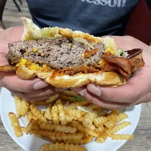 Bacon cheese burger with lettuce &amp; ketchup.