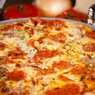 a pizza with pepperoni and cheese