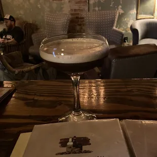 a book and a glass of wine