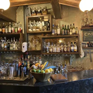 a bar with many bottles of alcohol