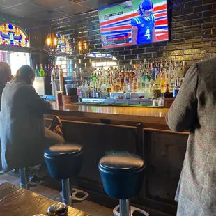 people sitting at the bar