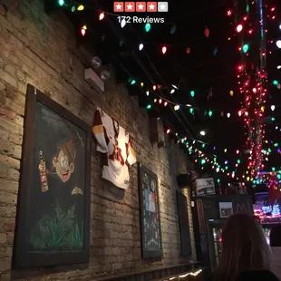 a brick wall with christmas lights