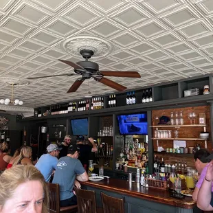 people sitting at the bar