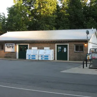 a brick building with a metal roof