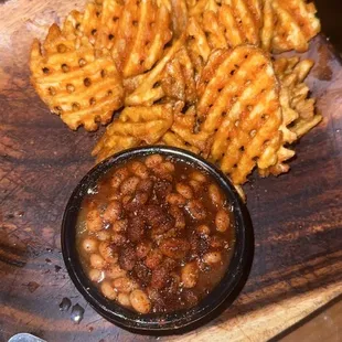 Seasoned waffle fries and baked beans