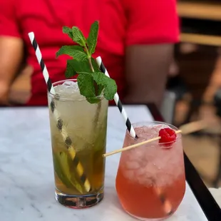 two cocktails on a table
