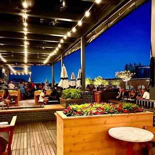 a patio with tables and chairs