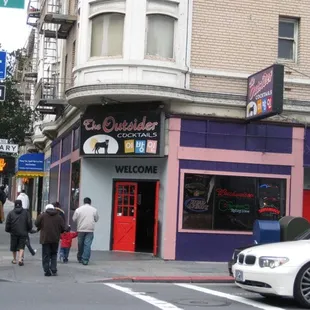 a group of people walking down the street
