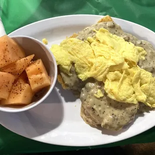 Brunch Biscuits and Gravy. This dish is served with your choice of tater tots or spiced melon (topped with Tajin).