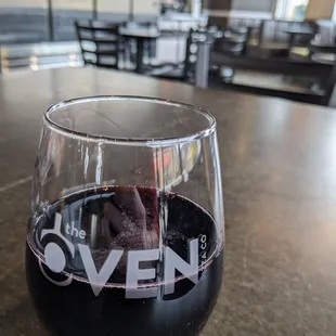 a glass of wine on a table