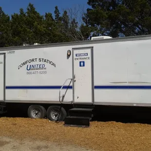 Bathrooms are outside (because you will surely be looking for them first).  Just to the right as you pull up to the parking lot.