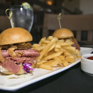 two sandwiches and french fries