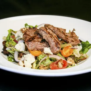 a salad with meat and vegetables