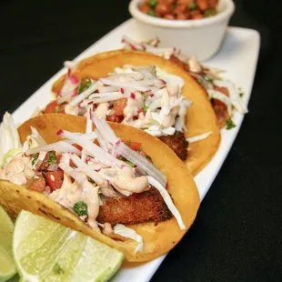two fish tacos on a plate