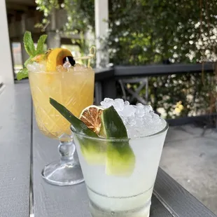 two cocktails on a table