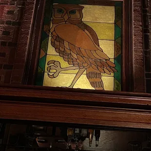 a stained glass window above the bar