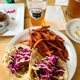 Jerk Tofu Tacos (spicy) with side of sweet potato fries.