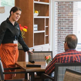 a waitress serving customers
