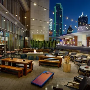 an outdoor dining area with tables and chairs
