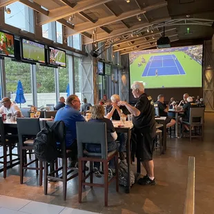 Dining area with massive TV