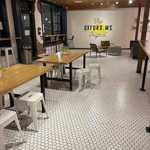 a dining room with tables and chairs