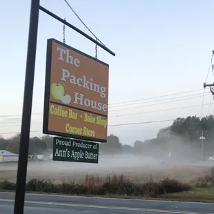 a foggy field and a sign