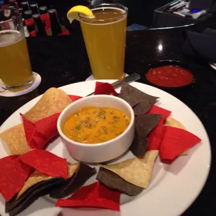 Chips with salsa and Queso along with my favorite brew, Boulevard Wheat... All very delicious while we wait for the   Game !!