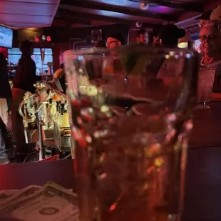 a drink in a glass on a bar