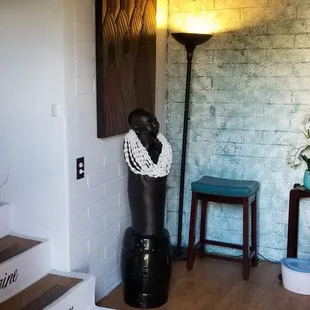 Up the steps on your left.