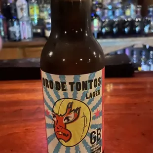 a bottle of beer on a bar