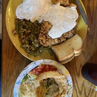 Pork loin, mashed potatoes, green beans and a salad