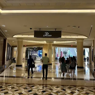 people walking through the lobby