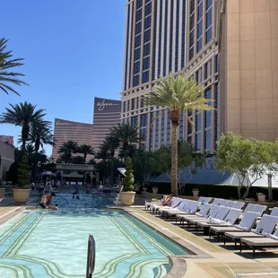 a swimming pool in front of a hotel
