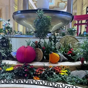 a fountain in the center of a garden