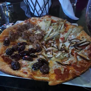 Quattro Stagioni pizza - a much beloved pizza in Italy, and this one is done correctly separating out the four seasons.