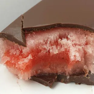 Dark chocolate draping watermelon chili paleta.