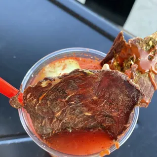 a large piece of meat in a cup