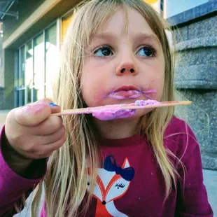 My daughter eating the gumball flavored paleta dipped in milk chocolate. It wasn't my flavor style but as you can see she devoured it!