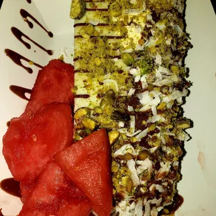 Avocado with drizzled chocolate, coconut, pistachio and chunky watermelon