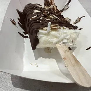 Almond joy half dipped with dark chocolate.