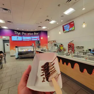Cookies and cream bar with oreo crumble and milk chocolate drizzle.