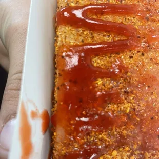 a person holding a tray of food