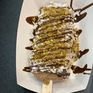 Hazelnut crunch waffle cone Paleta with Marzapan, coconut flakes and pistachios