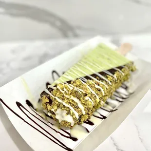 Pistachio - half dipped in dark chocolate, pistachios, &amp; drizzled white chocolate. :P